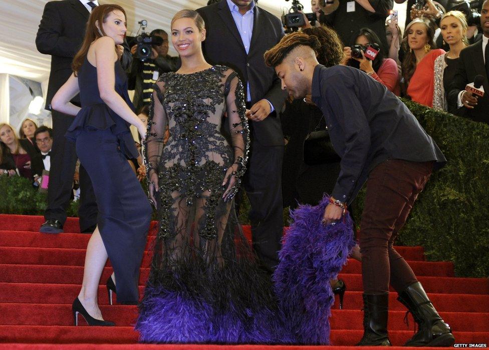 Beyonce has her dress rearranged at the Met Gala in 2012