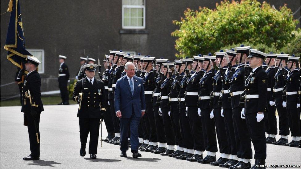 The Prince of Wales inspects an honour guard during a visit to Cork Naval Base