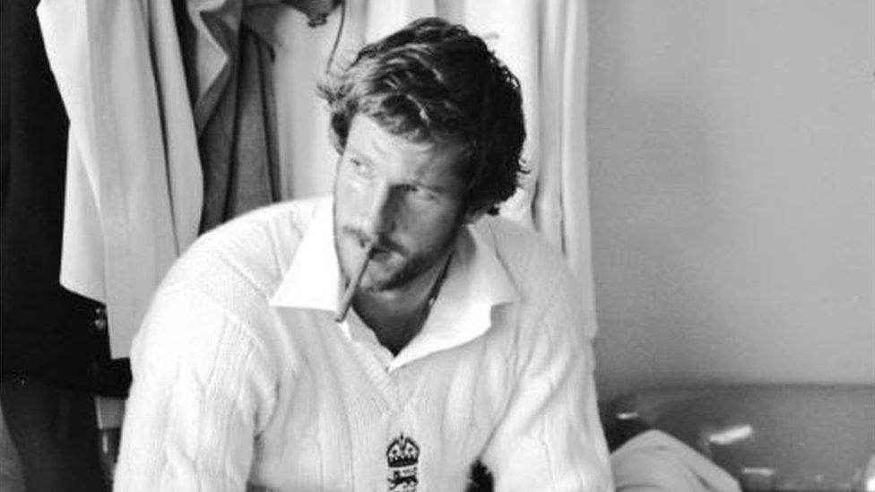 Sir Ian Botham smoking a cigar