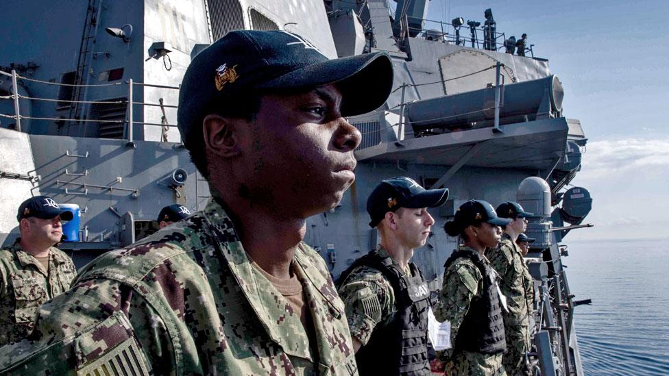 Sailors man the rails aboard the guided-missile destroyer USS Donald Cook, 11 April 2018.