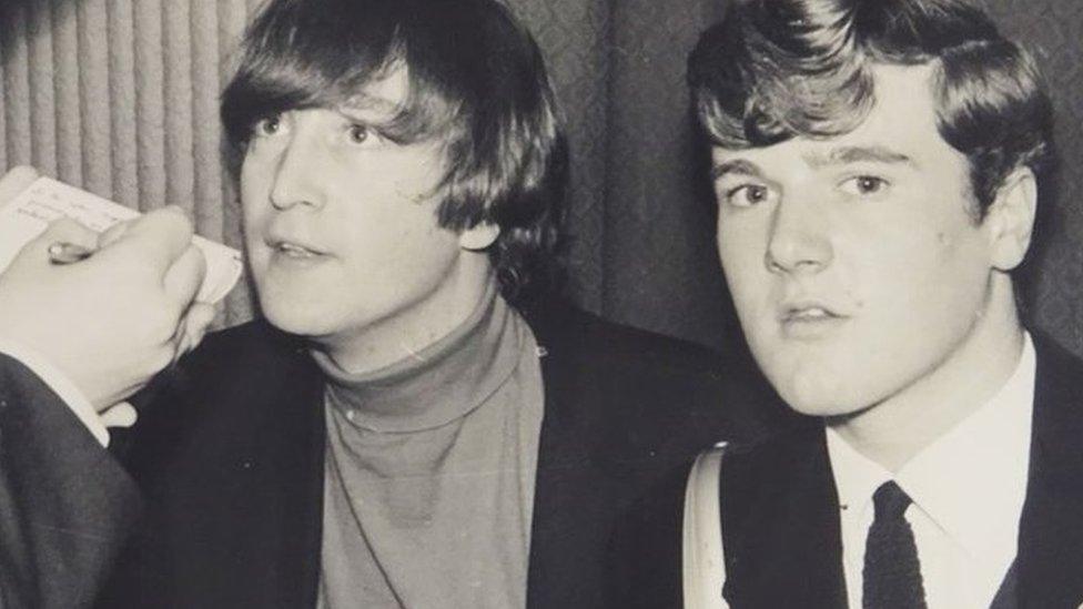 John Lennon (middle) interviewed by students in 1964