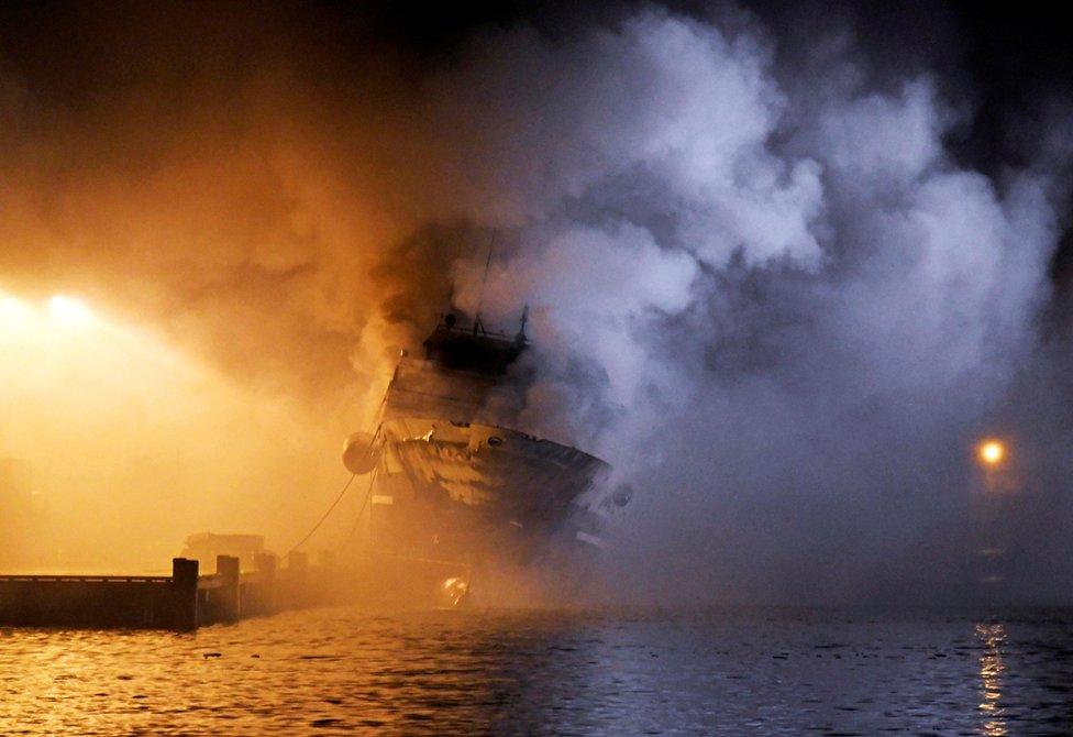 The Russian fishing trawler Bukhta Nayezdnik burns in the harbour of Tromso, Norway September 26, 2019.