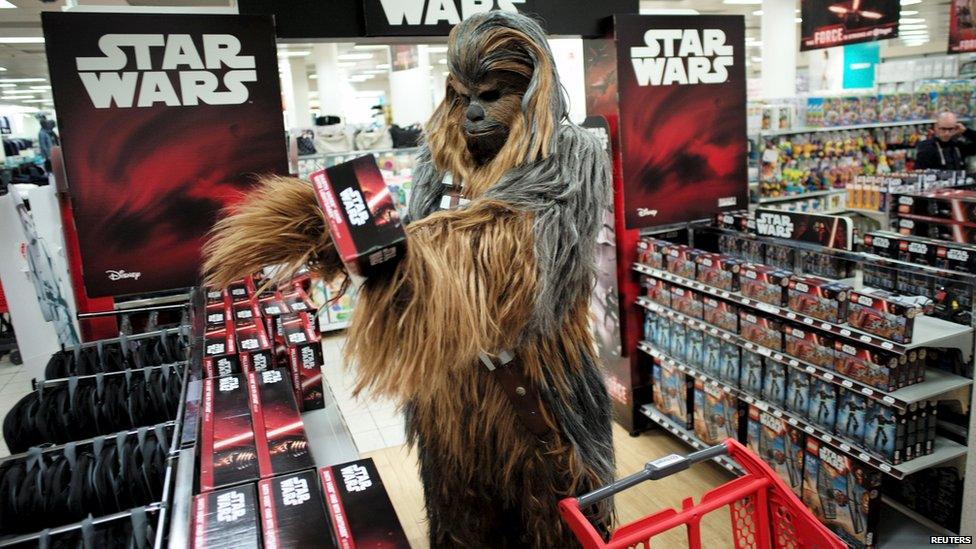 Fan dressed as Chewbacca shops