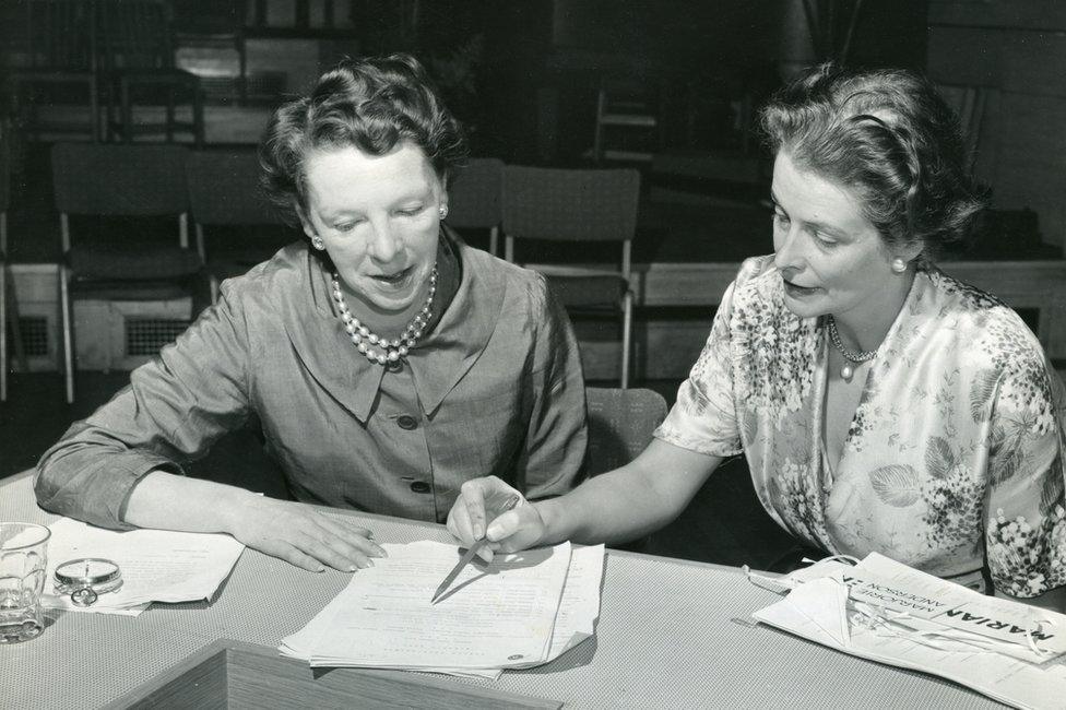 Miss Janet Quigley, MBE, Editor of BBC Woman's Hour, and Joanna Scott-Moncrieff, Deputy Editor, discussing the programme's first public performance from London. On 29th August, 'Woman's Hour' returned after the summer break with a special 'welcome back' edition, broadcast before an invited audience in the Concert Hall at Broadcasting House, London.