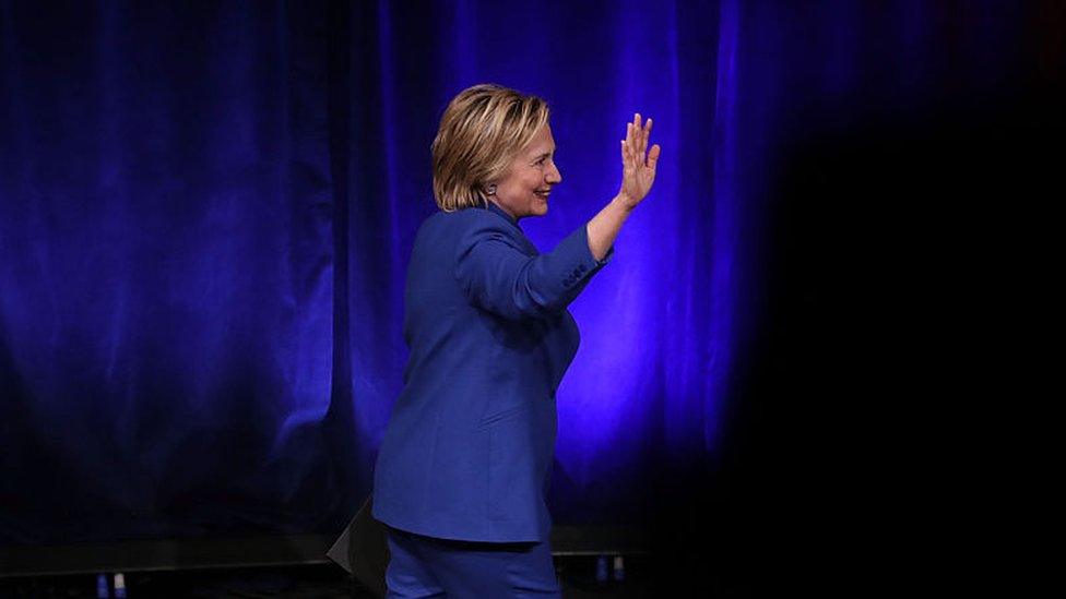 Hillary Clinton waves as she leaves the stage at a post-election speech.