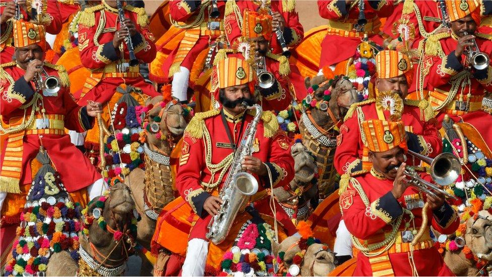 Indian Border Security Force (BSF) soldiers play music as they ride their camels during India's Republic Day parade in New Delhi, India, January, 26, 2020.