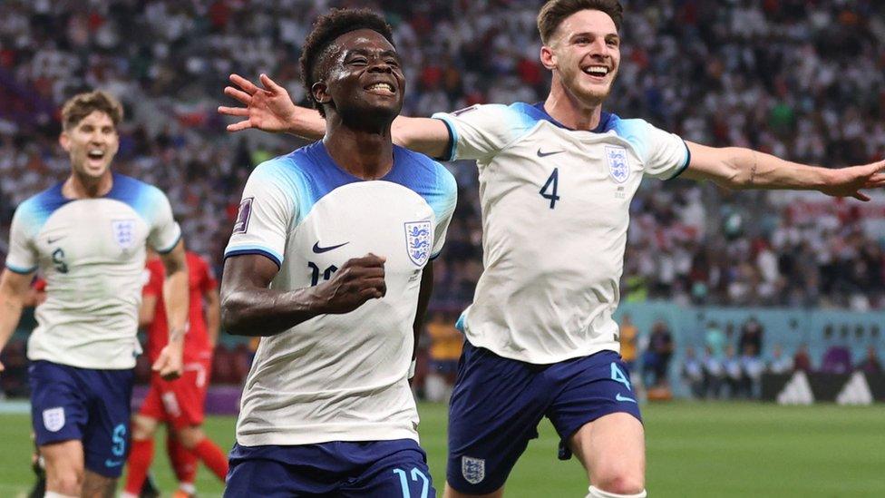 Bukayo Saka (centre) celebrates scoring