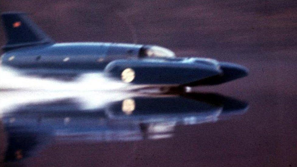 The original Bluebird speeds across a lake