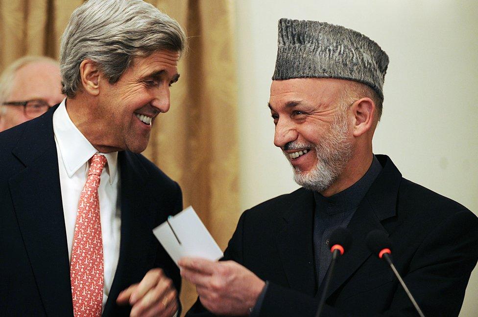 US Senator John Kerry laugh with Afghan President Hamid Karzai at a press conference at the presidential palace in Kabul, 20 October 2009