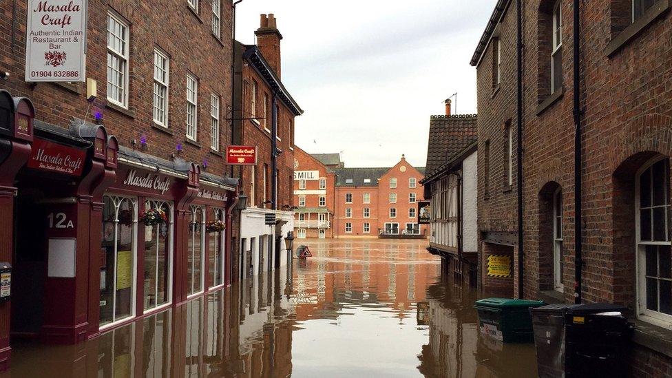 Flooded riverside properties in Kings Street, York