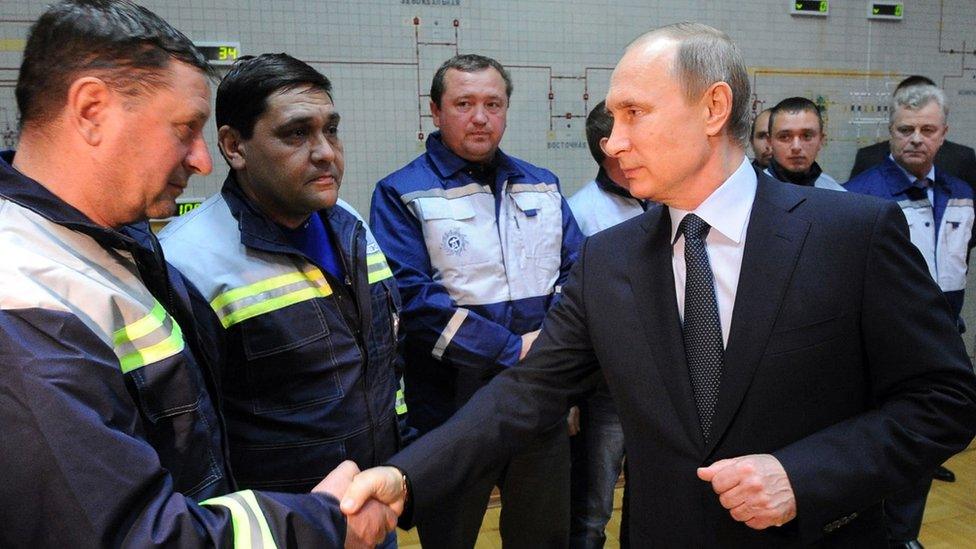 Russian President Vladimir Putin (front R) meets staff of Crimean electricity company Krymenergo in Simferopol, 2 Dec 15