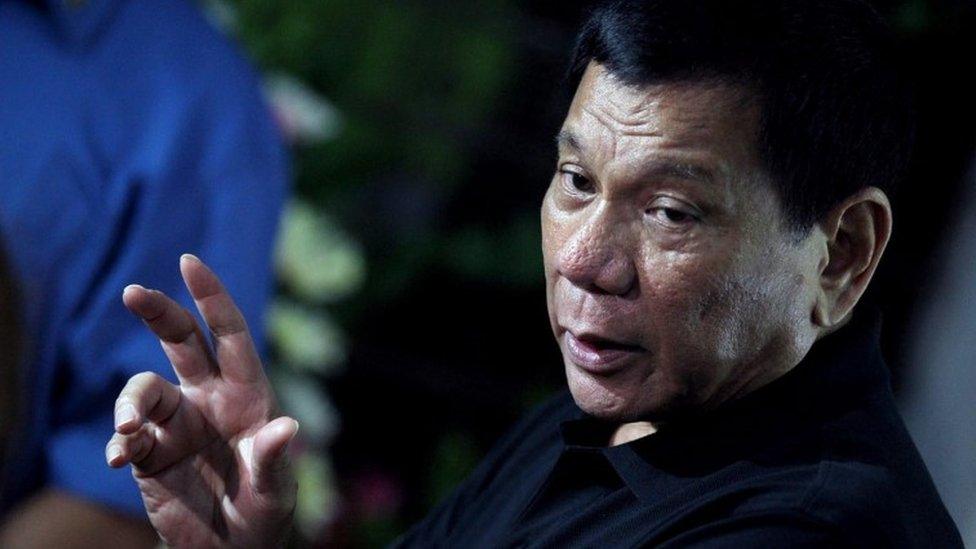 Philippines President Rodrigo Duterte, 2 November 2016, at the grave of his mother to mark All Saints Day