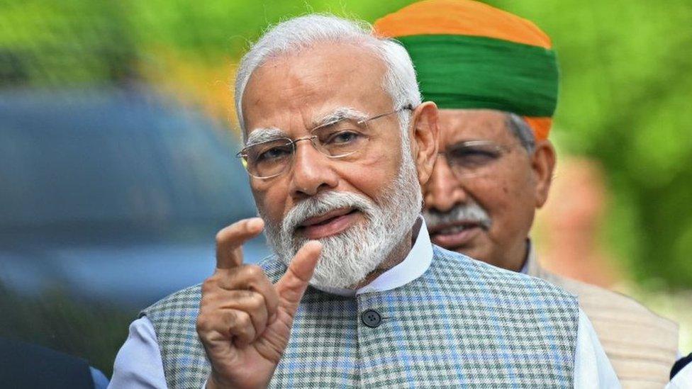 India's Prime Minister Narendra Modi addresses the media representatives upon his arrival to attend the special session of the parliament in New Delhi on September 18, 2023.