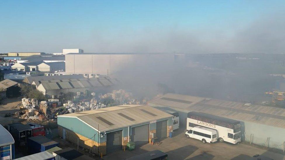 Smoke coming from a fire at a recycling factory in Corby