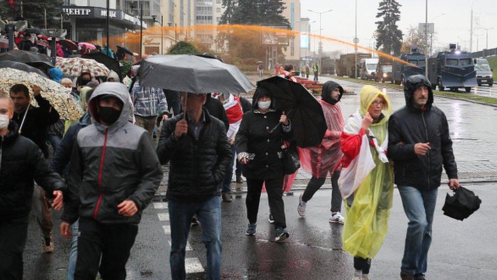 Belarus police use water cannon against protesters in the capital Minsk