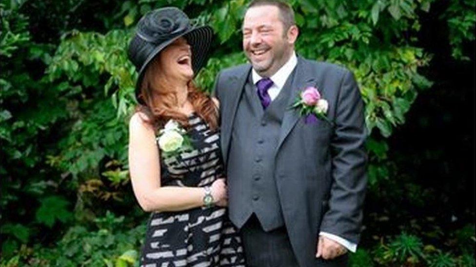 Helen Crowther and Andy Clewes laughing at his wedding