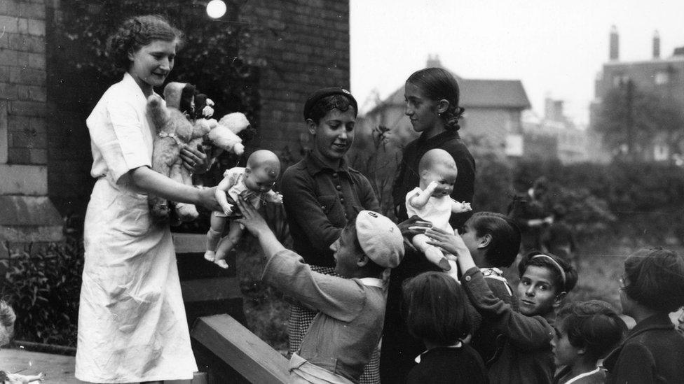 Basque children being given toys in Watermillock, Bolton, where they are refugees