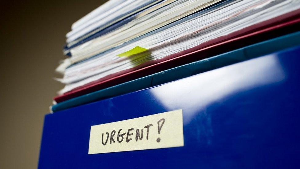 Pile of papers in an in-tray