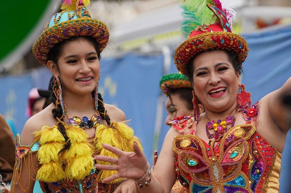 Bolivian cultural dancers wait to perform at London's New Year's Day concert in Waterloo Place, London