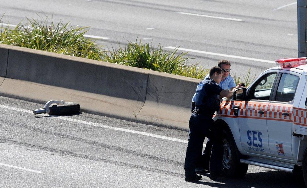 An aircraft wheel on the road near the crash site in Melbourne (21 Feb 2017)