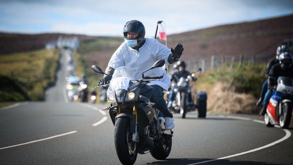 Motorcycle rider dressed in a hospital gown