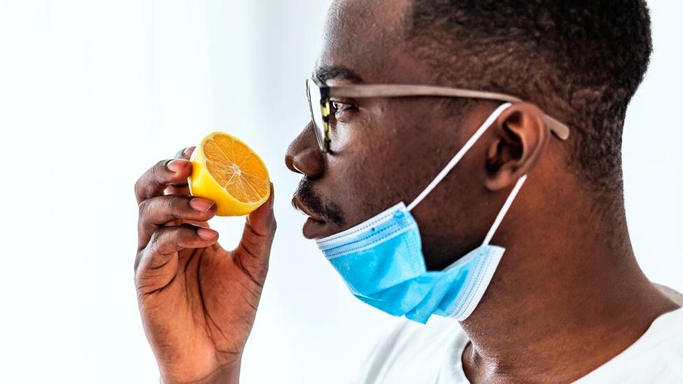 Man sniffing a lemon