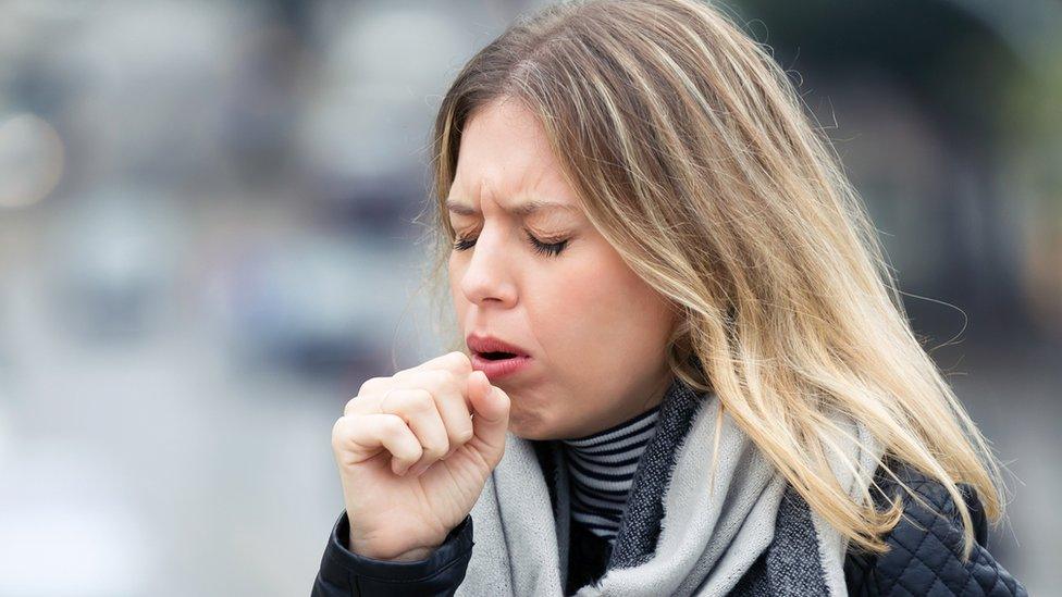 Woman coughing