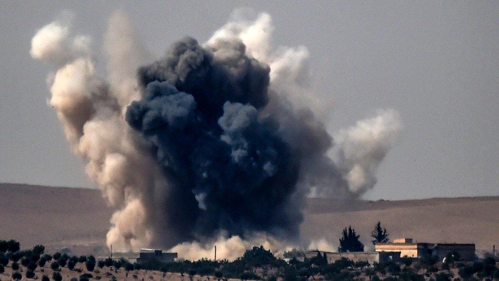 Smoke rises over Jarablus, Syria, 24 August