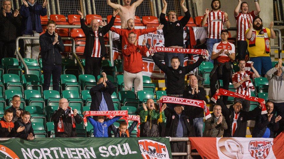 Derry City supporters celebrate at a match