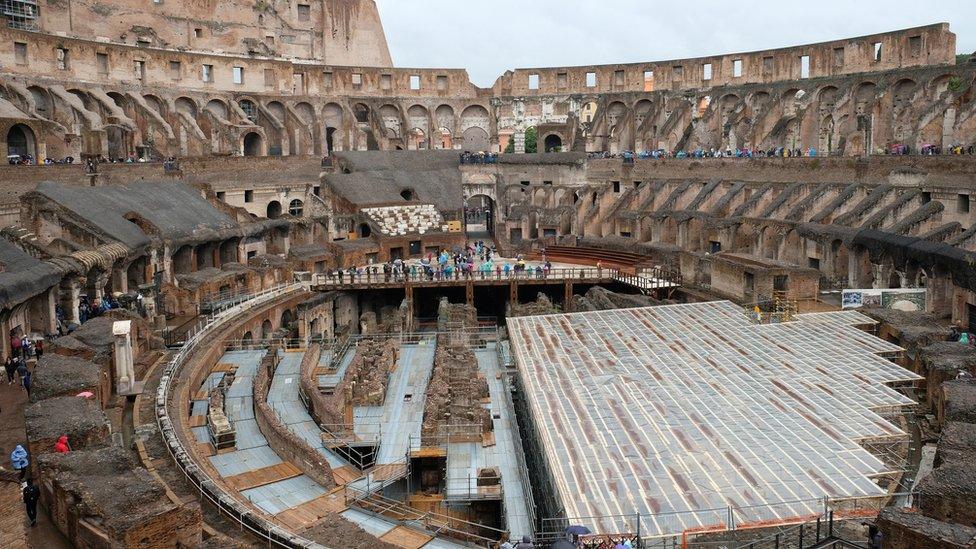 Foreign tourists seen in the amphitheatre of the Colosseum