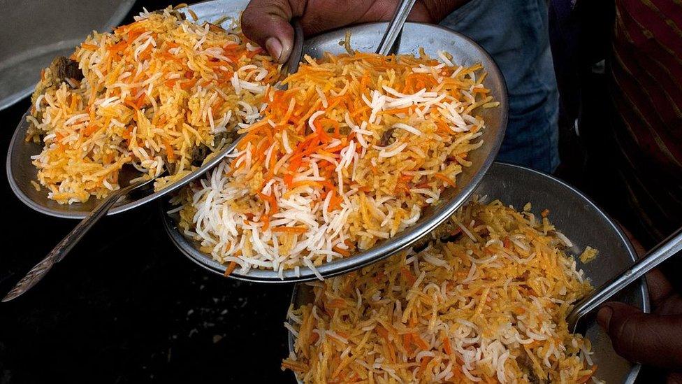 Plates of mutton biryani are served at an outside eatery in Lucknow on November 22, 2014.