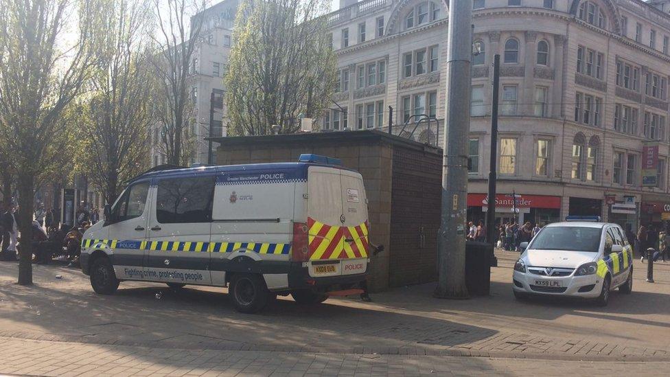 Police vans in Piccadilly Gardens