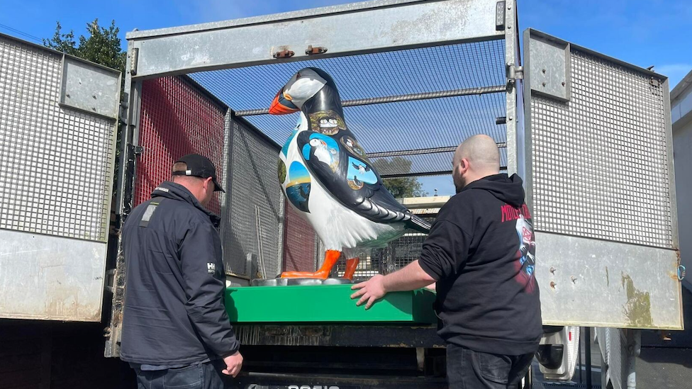 Puffin statue in a van