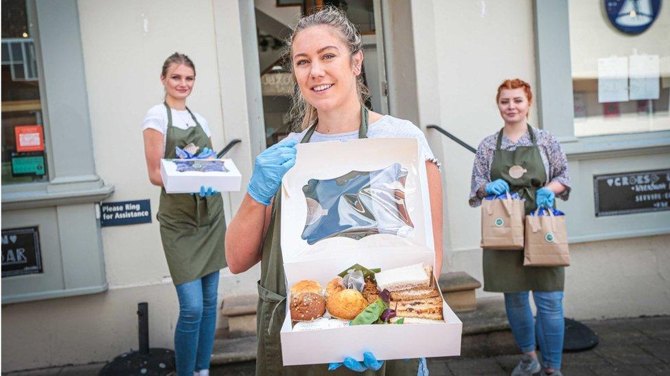 Sarah Baker holding a takeaway box