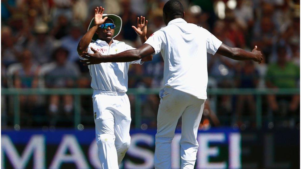 Kagiso Rabada (R) of South Africa celebrates with Temba Bavuma of South Africa who caught out Nick Compton of England during day one of the 2nd Test at Newlands Stadium on January 2, 2016 in Cape Town, South Africa.