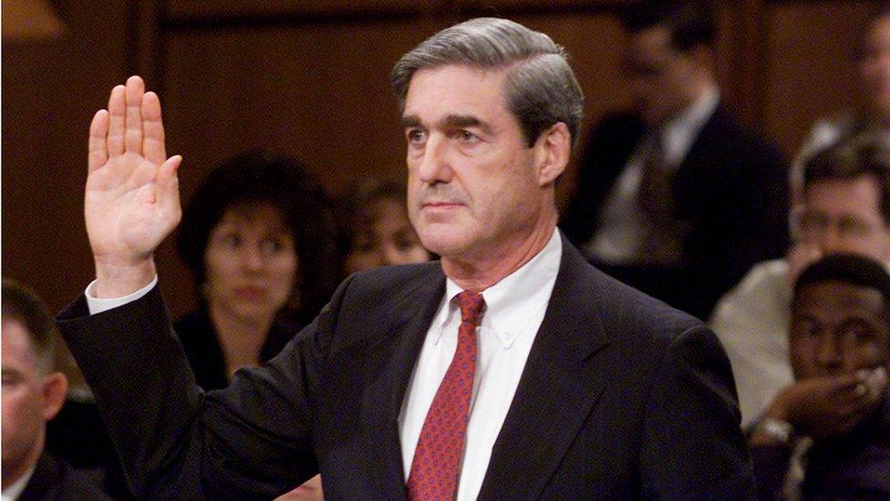 Robert S. Mueller III, President Bush's choice to become director of the Federal Bureau of Investigation, raises his right hand while being confirmed in 2001