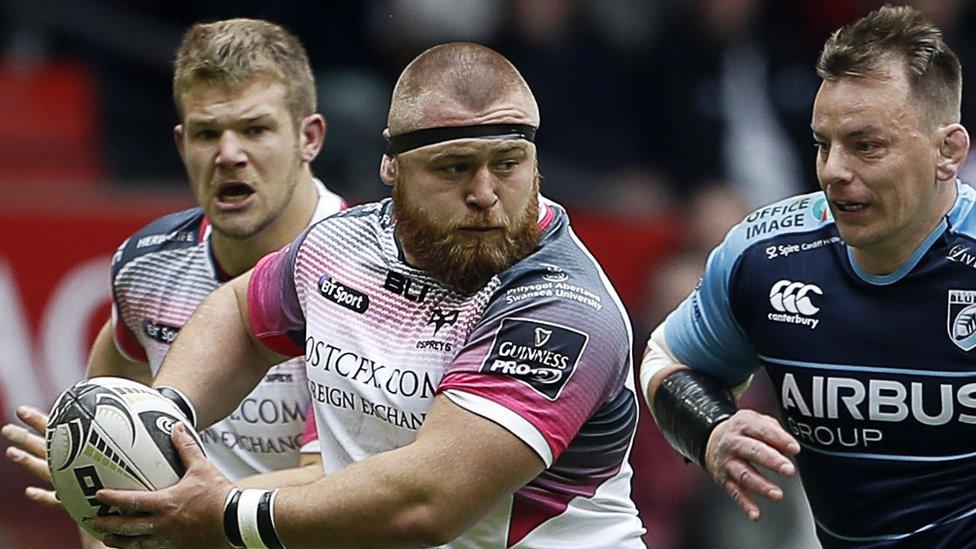 Ospreys prop Dmitri Arhip is chased by Blues hooker Matthew Rees