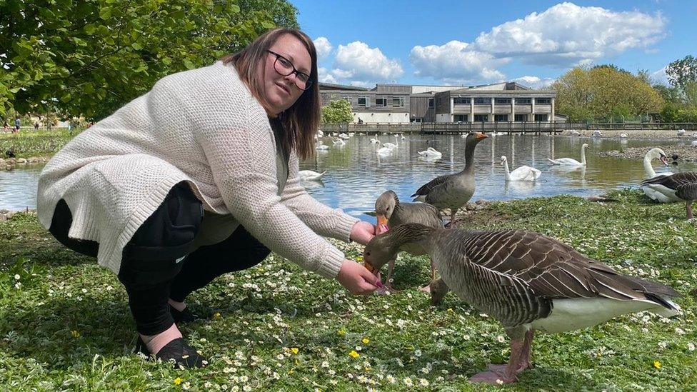 Becca Gannaway-Pitts feeding ducks