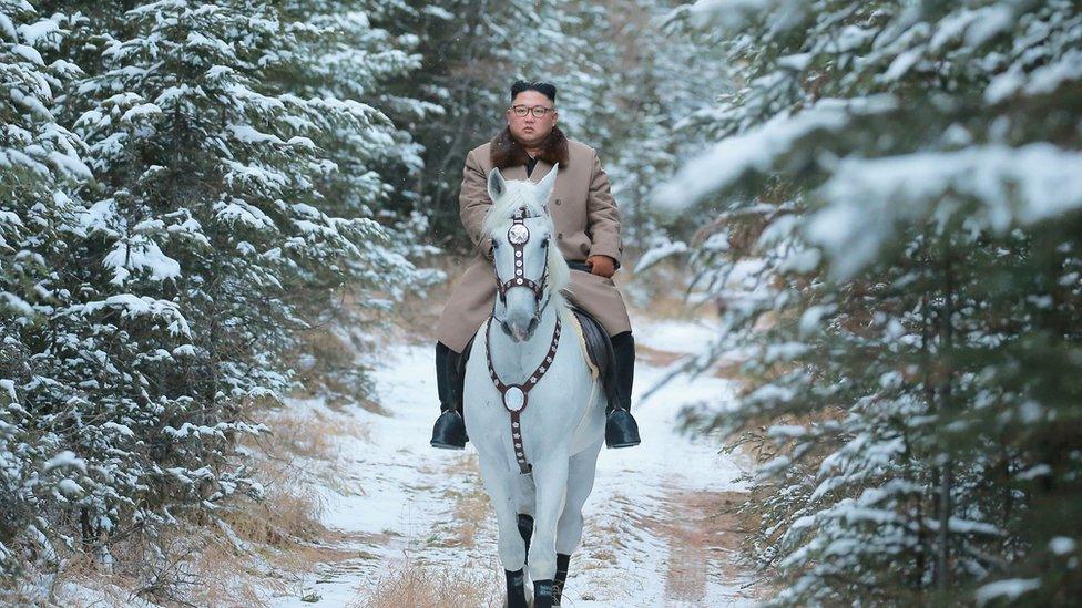 North Korean leader Kim Jong Un rides a horse during snowfall in Mount Paektu