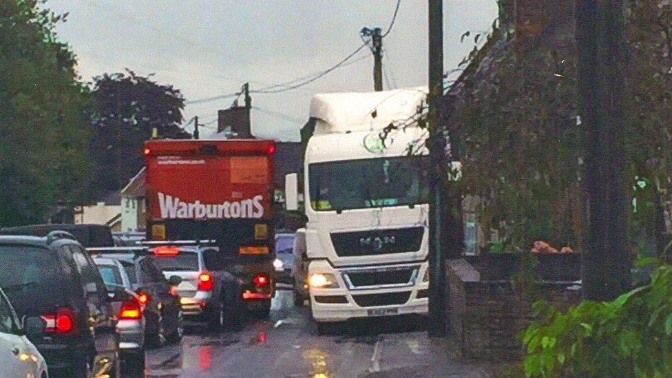 Lorry passing by Chapmanslade School