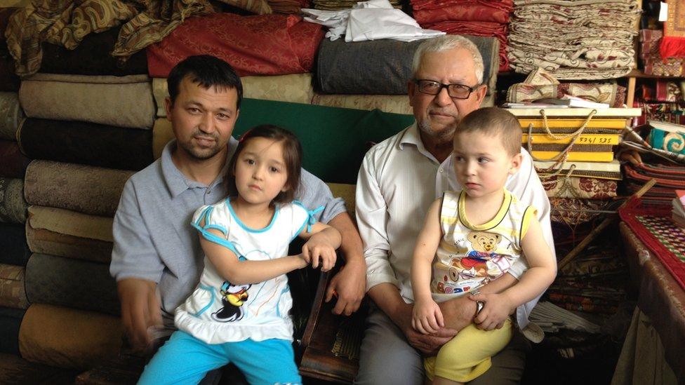 Abdul Aziz with his son and grandchildren