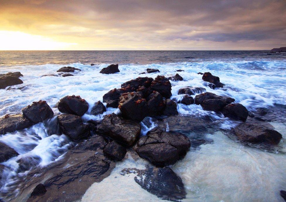 A peaceful morning at Mosquera Islet, near Santa Cruz Island, with the Sally Lightfoot crabs