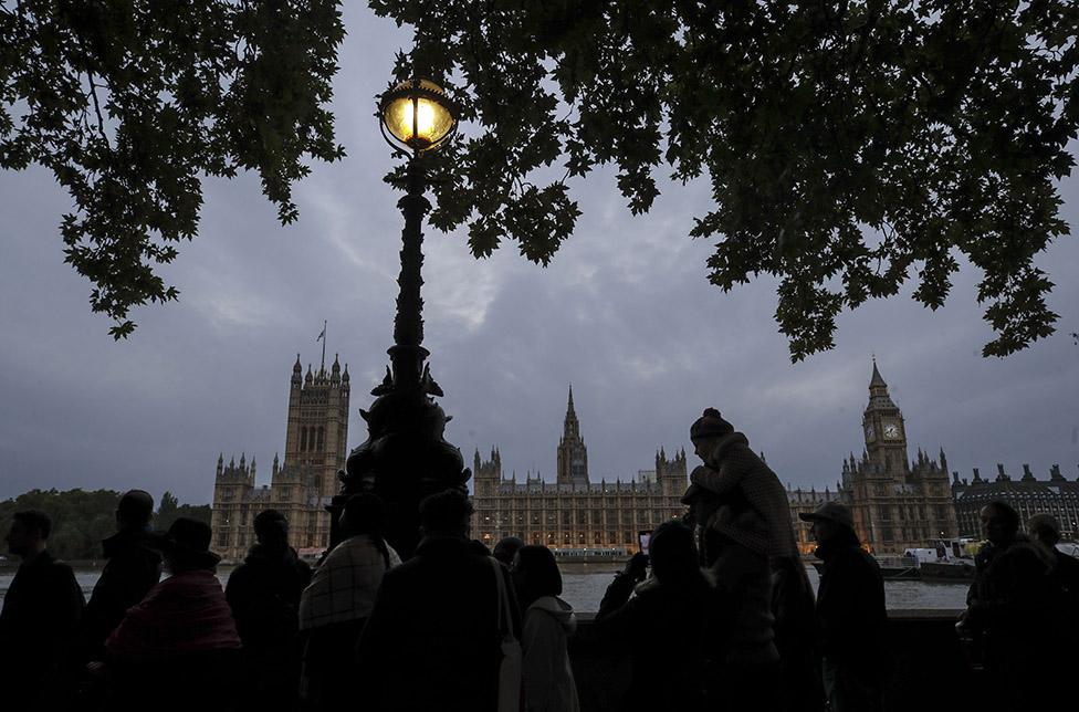 People queue to pay their respects to the Queen at her lying-in-state at Westminster Hall