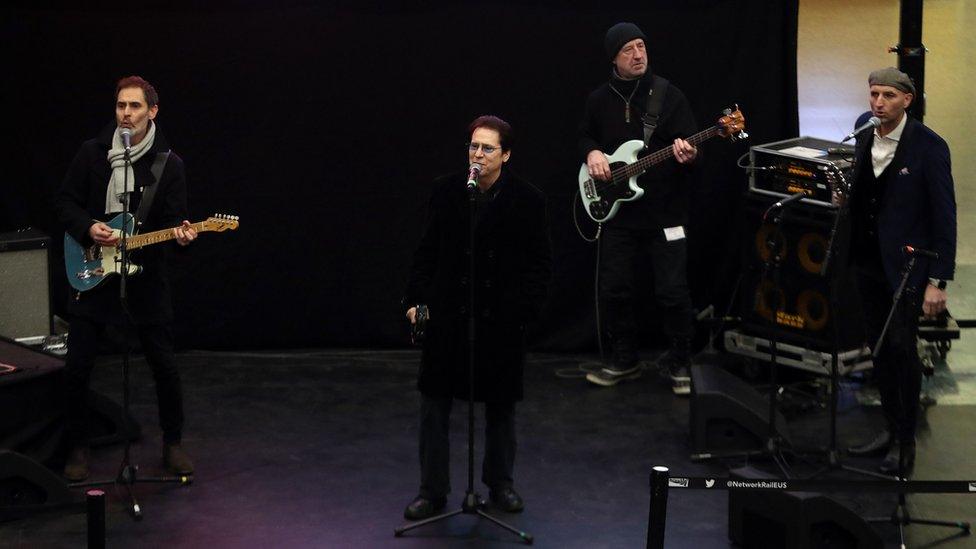 Shakin' Stevens performs at London Euston station