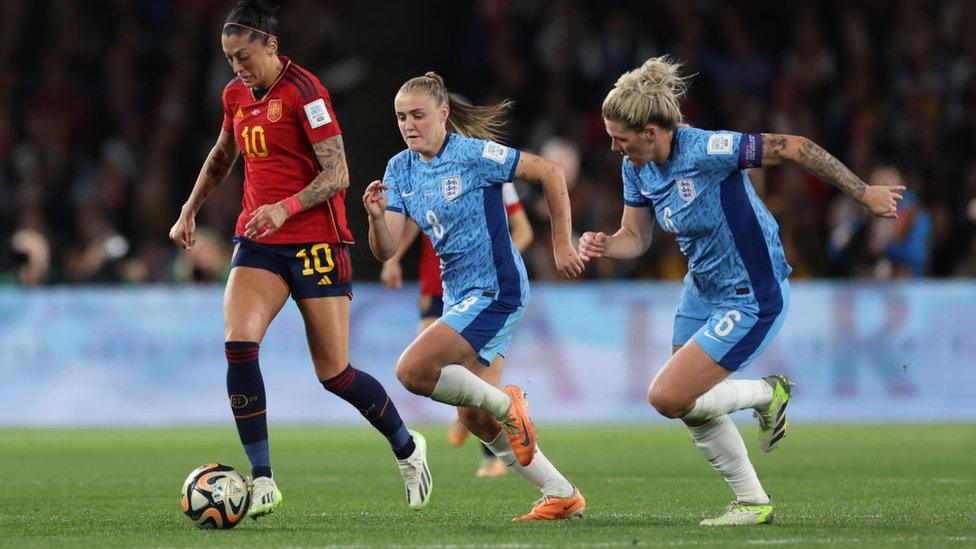 Jenni Hermoso of Spain gets past Georgia Stanway and Millie Bright of England during the FIFA Women's World Cup.