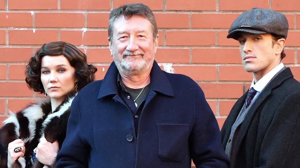 Peaky Blinders creator Steven Knight (centre) with dancers from Rambert's Peaky Blinders ballet