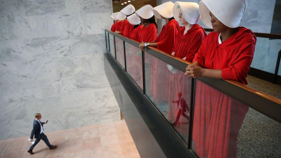 A group of women are seen dressed as 'Handmaids' from the Hulu original series 'The Handmaid's Tale' in the Hart Senate Office Building hearing in response to Supreme Court nominee Brett Kavanaugh's hearing.