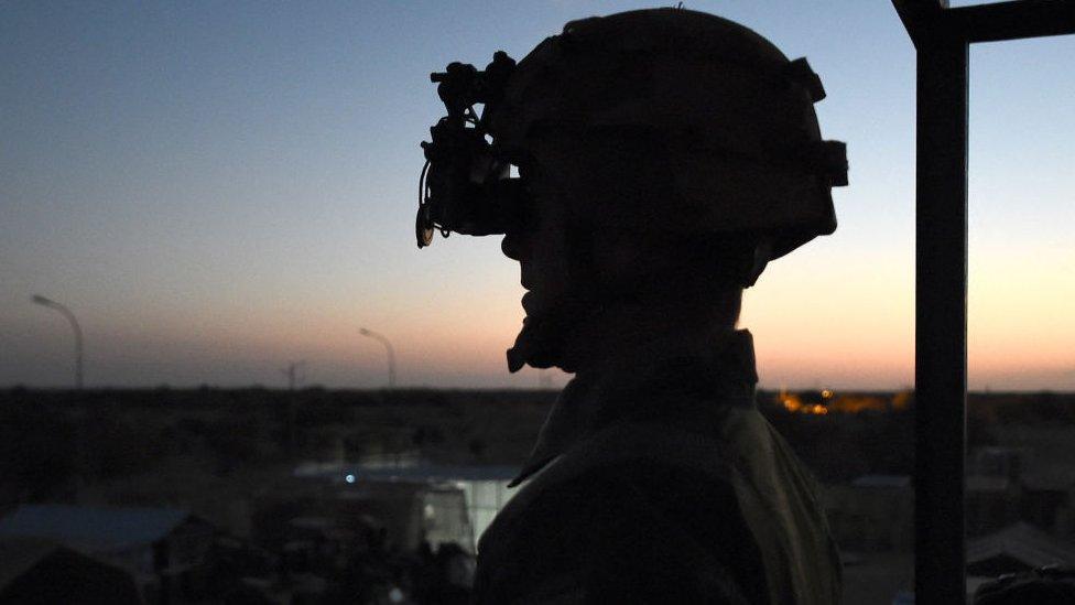 French soldiers of the operation Barkhane, an anti-insurgent operation in Sahel, equipped with night vision binoculars, stands guard on March 8, 2016 at the Paskal camp in Timbuktu.