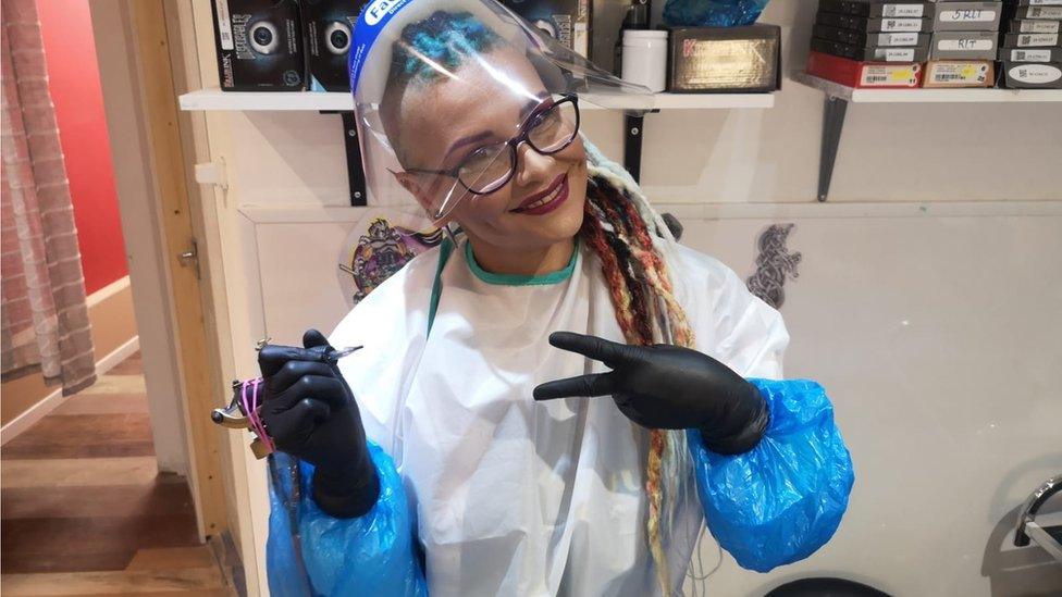 Jules Lee in PPE at her tattoo shop