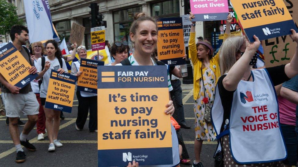 Protesters carrying banners reading "its time to pay nursing staff fairly"